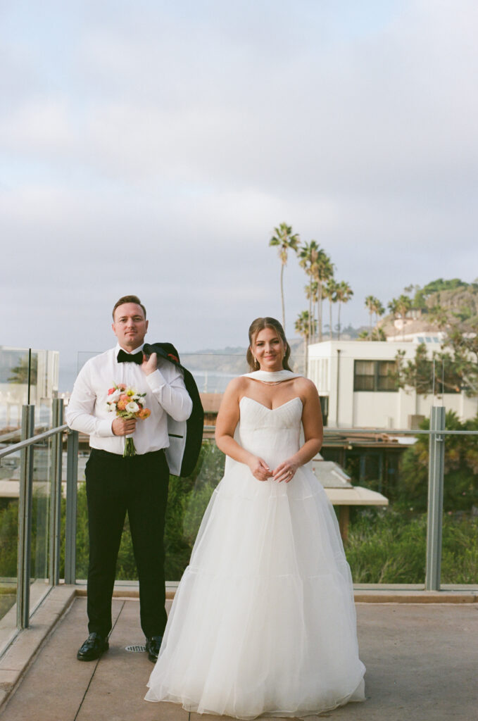 Film photograph of Ben and Lauren posing together at Scripps Seaside Forum