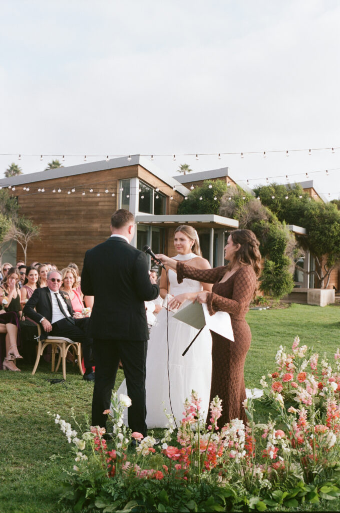 Film photograph of the bride and groom standing together during their California coast wedding