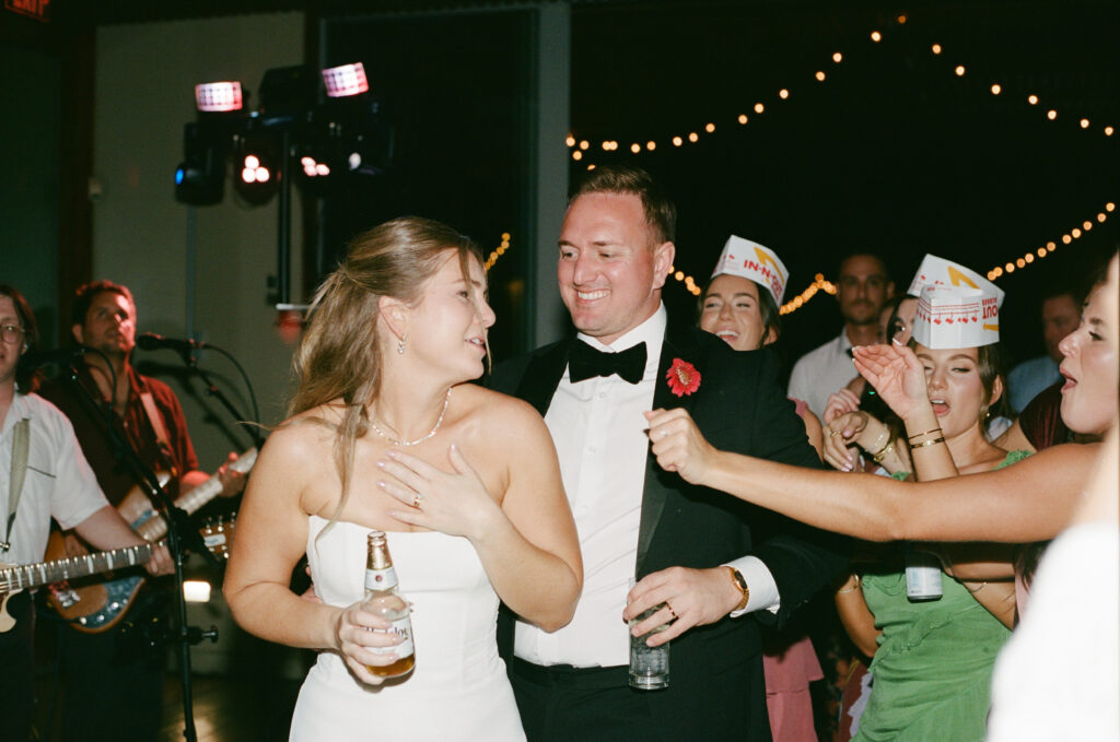 Film photograph of Ben and Lauren celebrating on the dance floor with their guests
