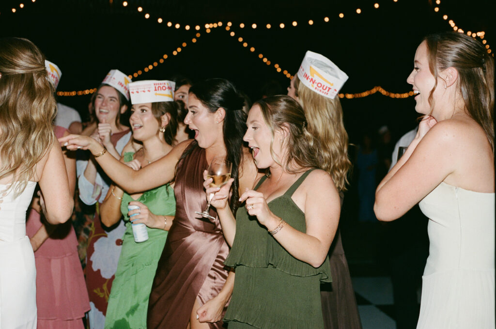 Film photograph of wedding guests dancing and celebrating together