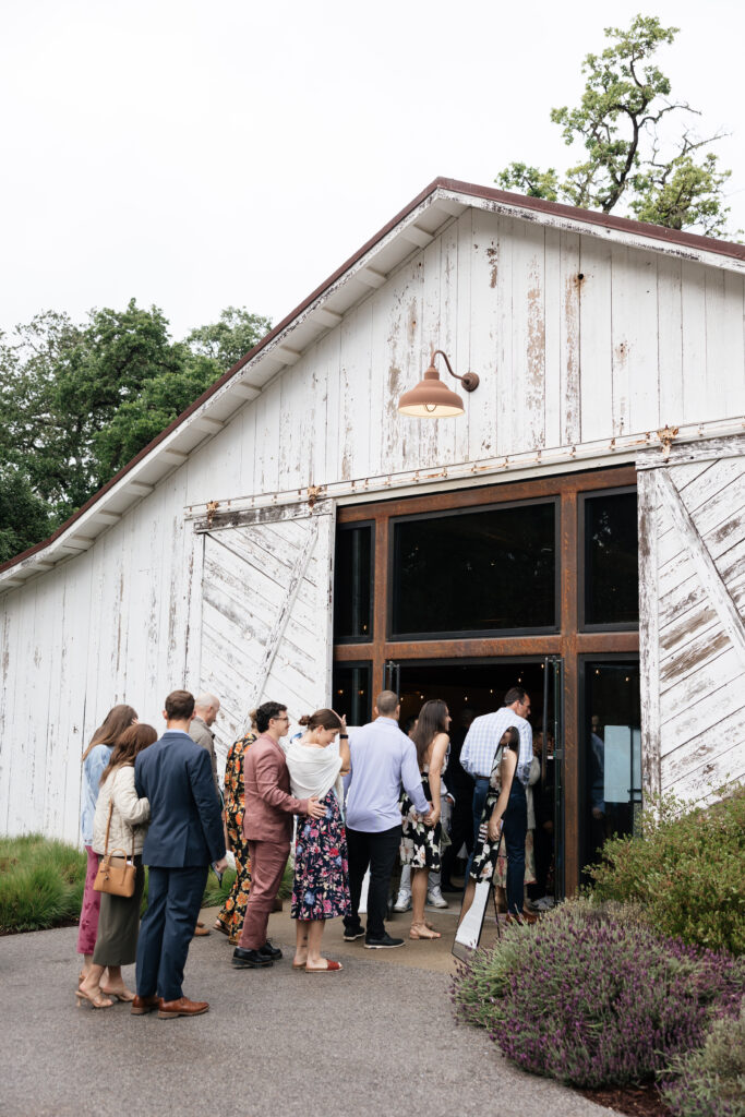 Guests entering the Halter Ranch barn for the wedding reception